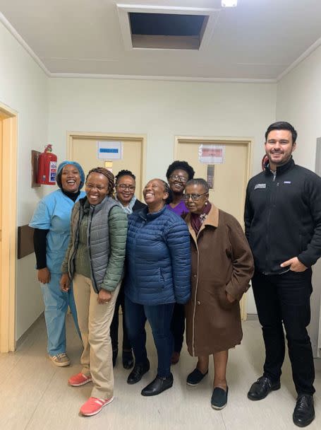 PHOTO: Dr. Kabelo Mputsoe (front left, in green) and Alejandro Nava (right) with other Senkatana Oncology Clinic staff in Lesotho, South Africa. (Courtesy of Alejandro Nava/Bristol Myers Squibb)