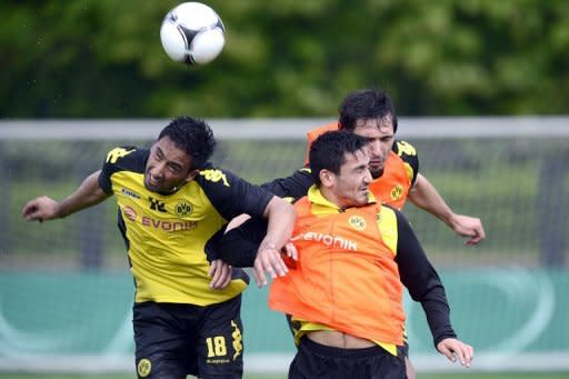 Dortmund striker Lucas Barrios (L) during a training session on May 11. Unbeaten in their last 22 games in all competitions since losing to Marseille in the Champions League last December, Dortmund have yet to lose in 2012