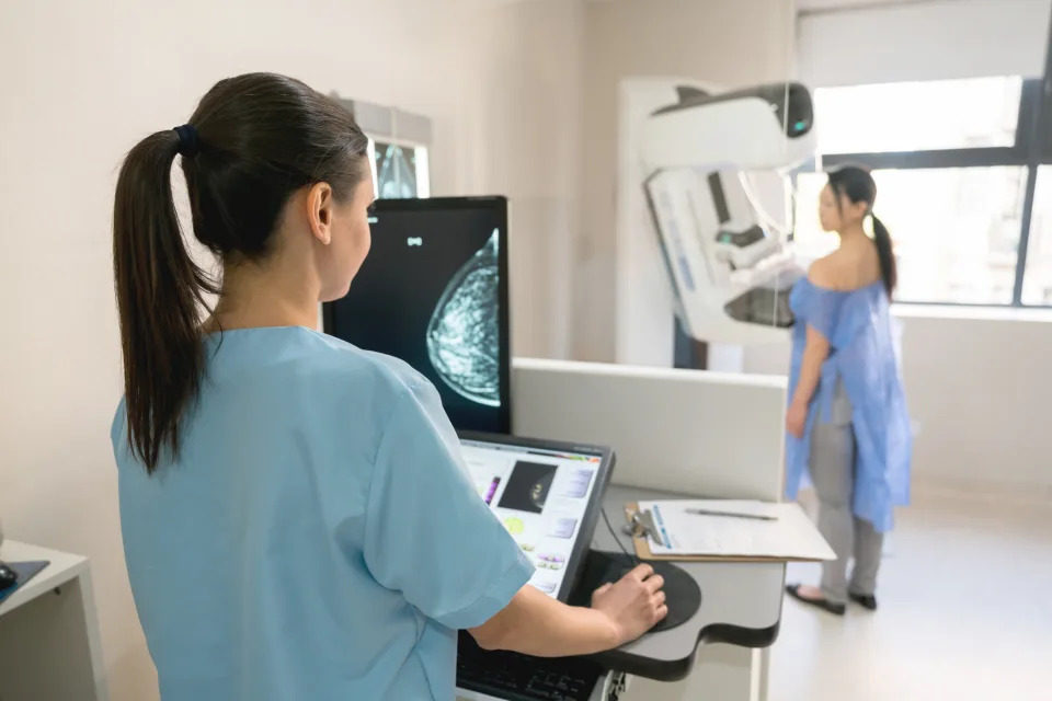 Unrecognizable nurse taking a mammogram exam to an adult patient at the hospital. (Photo via Getty Images)