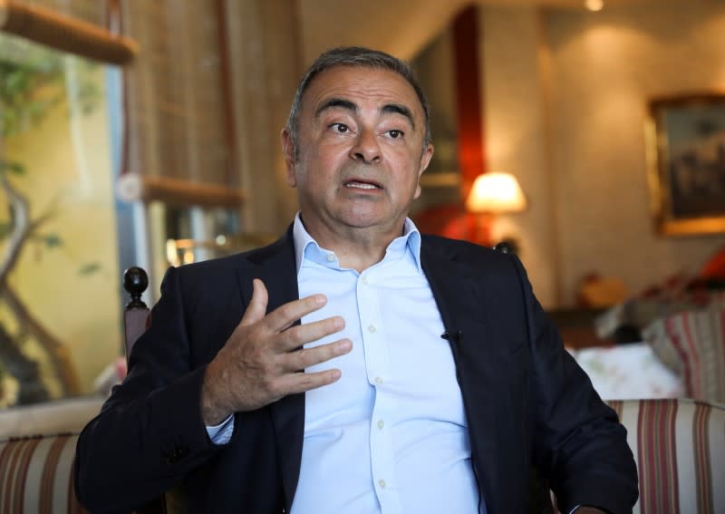 Fugitive former car executive Carlos Ghosn, gestures as he talks during an interview with Reuters in Beirut