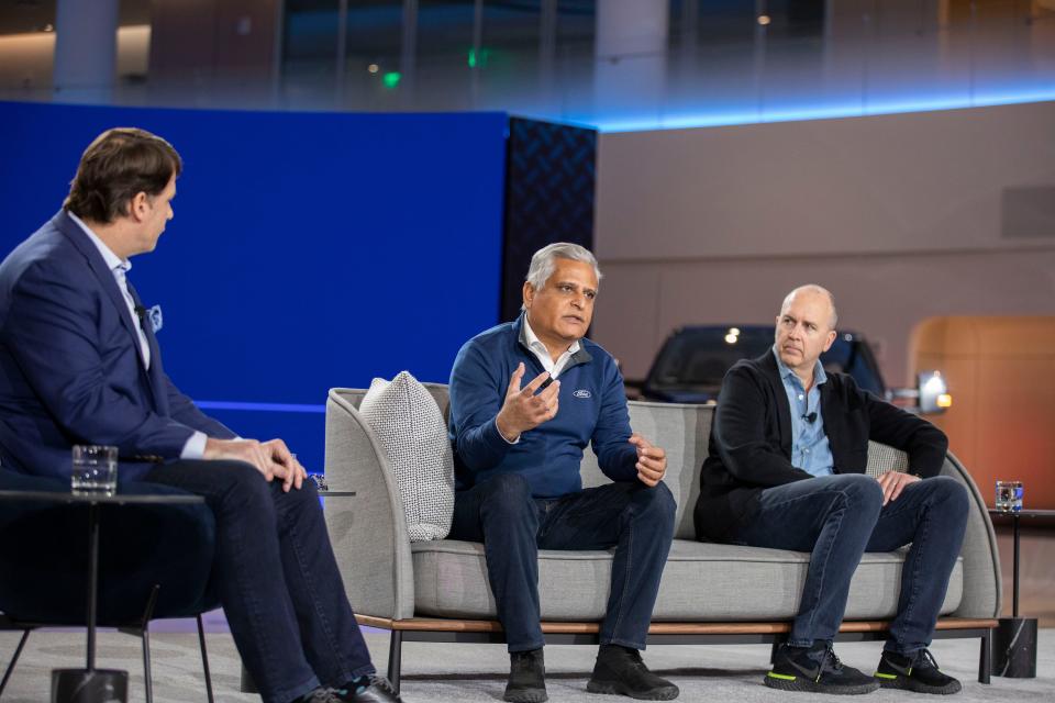 Ford has formed two auto businesses, Ford Blue and Ford Model e, that are separate divisions but work together to execute the Ford+ plan. Kumar Galhotra, president of Ford Blue, speaks while Ford CEO Jim Farley, left, and Doug Field, chief EV and digital systems officer for Ford Model e, listen. They're seen here during a webcast on March 2, 2022, in Dearborn.