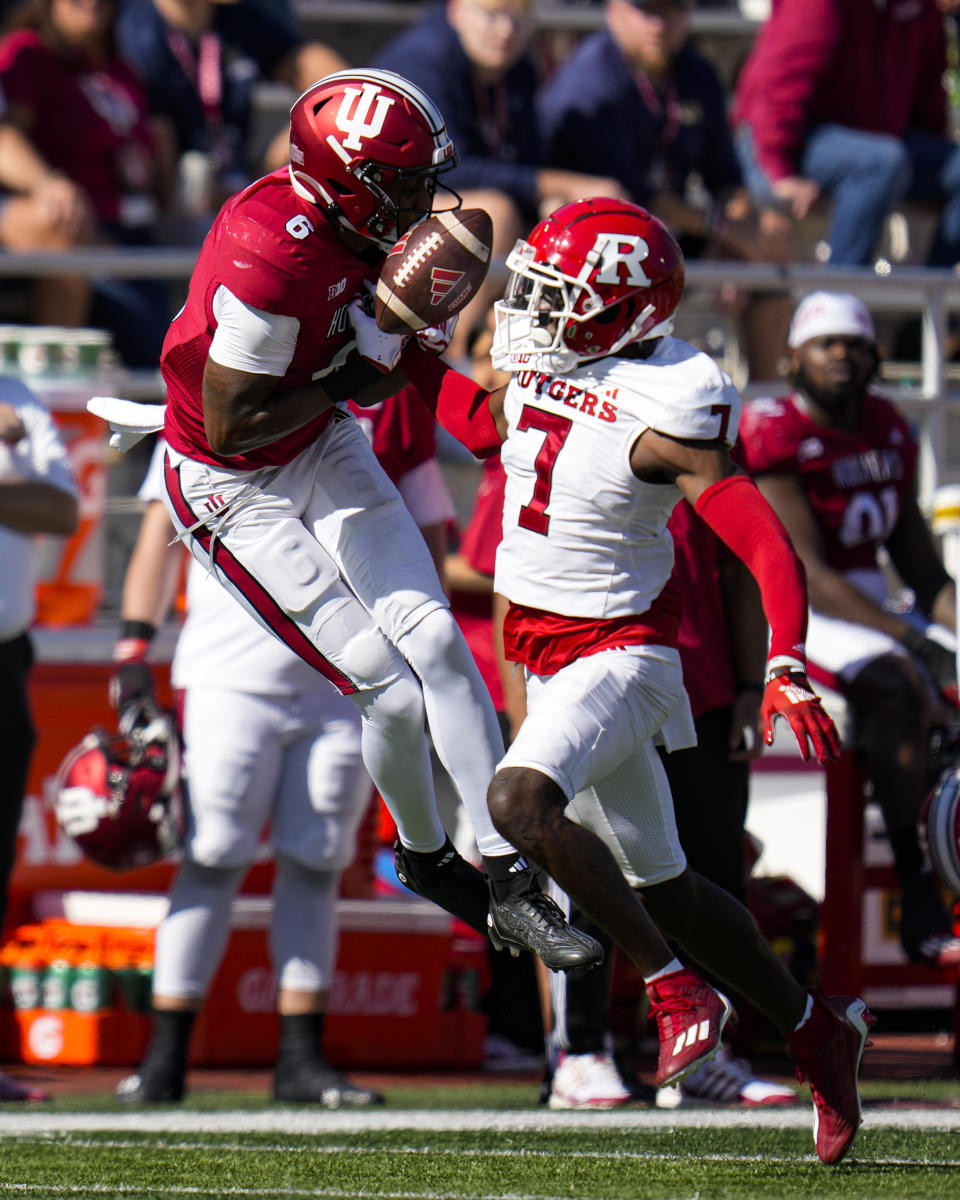 Rutgers defensive back Robert Longerbeam (7) breaks up a pass to Indiana wide receiver Cam Camper (6) during the second half of an NCAA college football game in Bloomington, Ind., Saturday, Oct. 21, 2023. Rutgers defeated Indiana 31-14. (AP Photo/Michael Conroy)