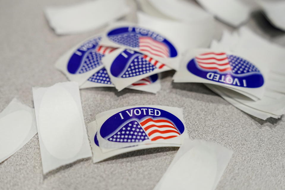 A pile of “I voted” stickers on a table on the last day of early voting in the Virginia gubernatorial election in Fairfax on Saturday.