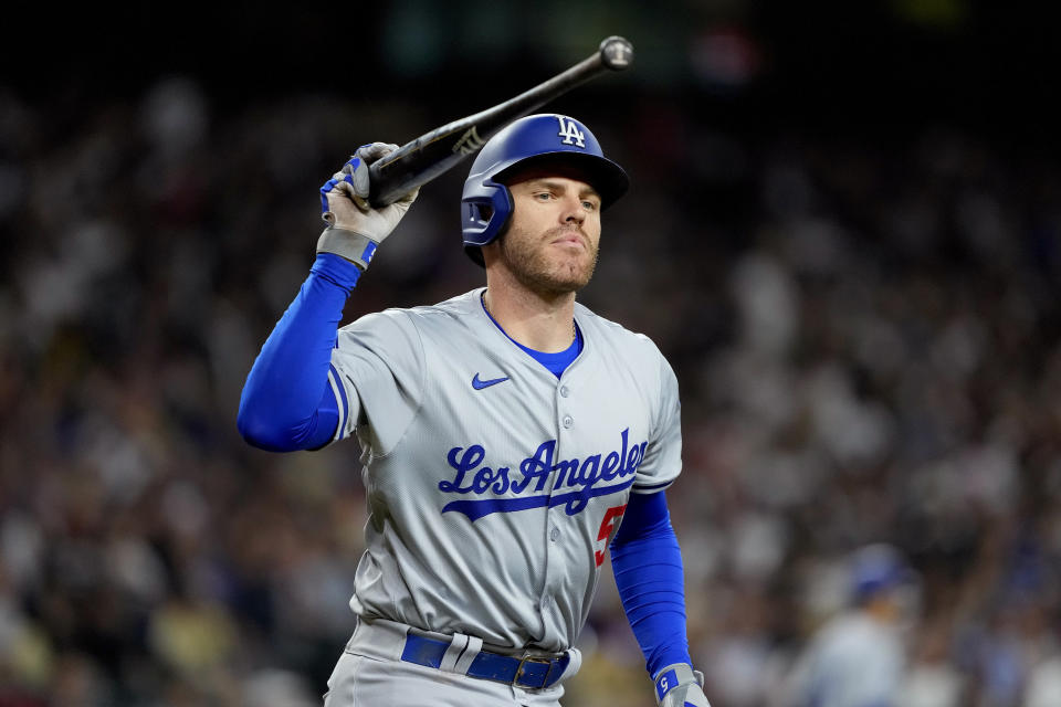 Los Angeles Dodgers' Freddie Freeman throws his bat after hitting a fly out during the eighth inning of a baseball game against the Arizona Diamondbacks, Monday, April 29, 2024, in Phoenix. (AP Photo/Matt York)