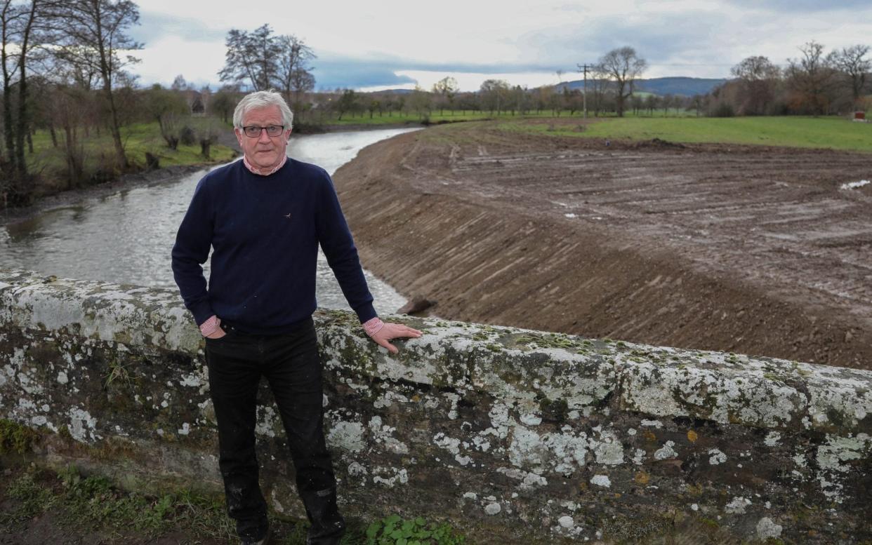 Farmer John Price who used a 16-ton digger to dredge a section of the River Lugg last year  - SWNS 