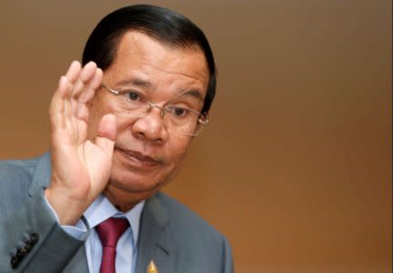 Cambodia's Prime Minister Hun Sen gestures as he attends a plenary session at the National Assembly of Cambodia in central Phnom Penh, October 16, 2017. REUTERS/Samrang Pring