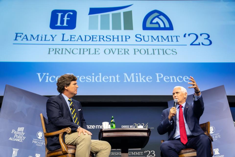 Former Vice President Mike Pence talks with moderator Tucker Carlson, left, during the Family Leadership Summit in Des Moines, Friday, July 14, 2023. 