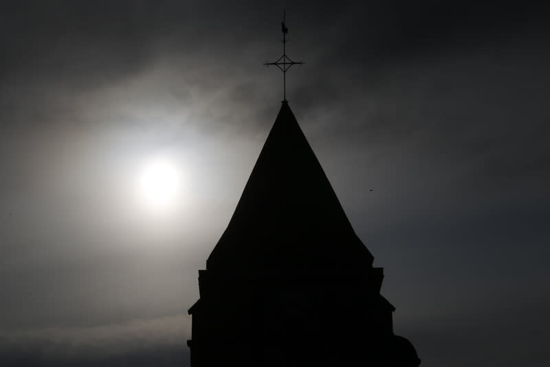 A view shows the bell tower of the church in Saint-Etienne-du-Rouvray near Rouen in Normandy, France, where French priest, Father Jacques Hamel, was killed with a knife and another hostage seriously wounded in an attack on the church that was carried out by assailants linked to Islamic State. REUTERS/Pascal Rossignol