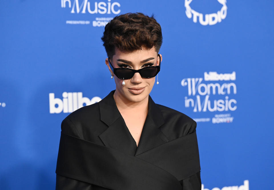 closeup of james peering over their sunglasses