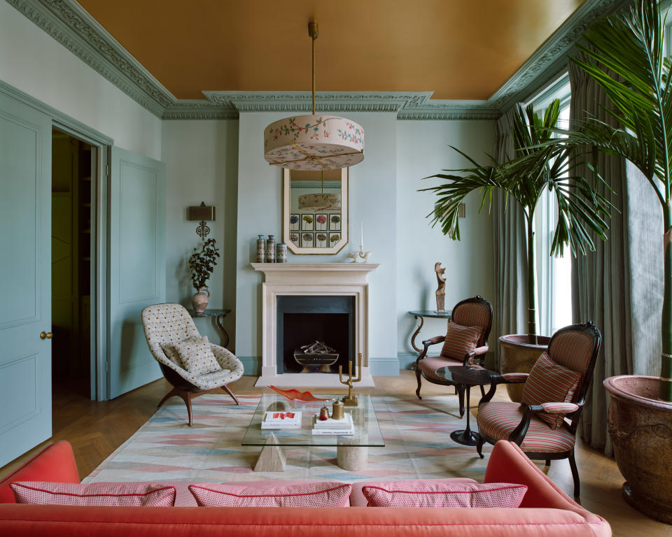 Blue living room with gold ceiling