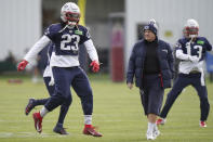 New England Patriots head coach Bill Belichick, center, walks near safety Kyle Dugger (23) and cornerback Jack Jones (13) during an NFL football practice, Tuesday, Dec. 6 2022, in Foxborough, Mass. (AP Photo/Steven Senne)