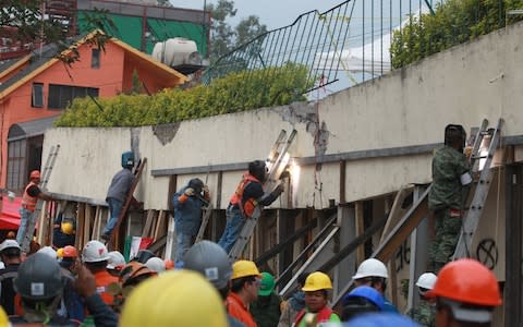 Rescuers work on the collapsed Enrique Rebsamen School in Mexico City - Credit:  MARIO GUZMAN/EFE