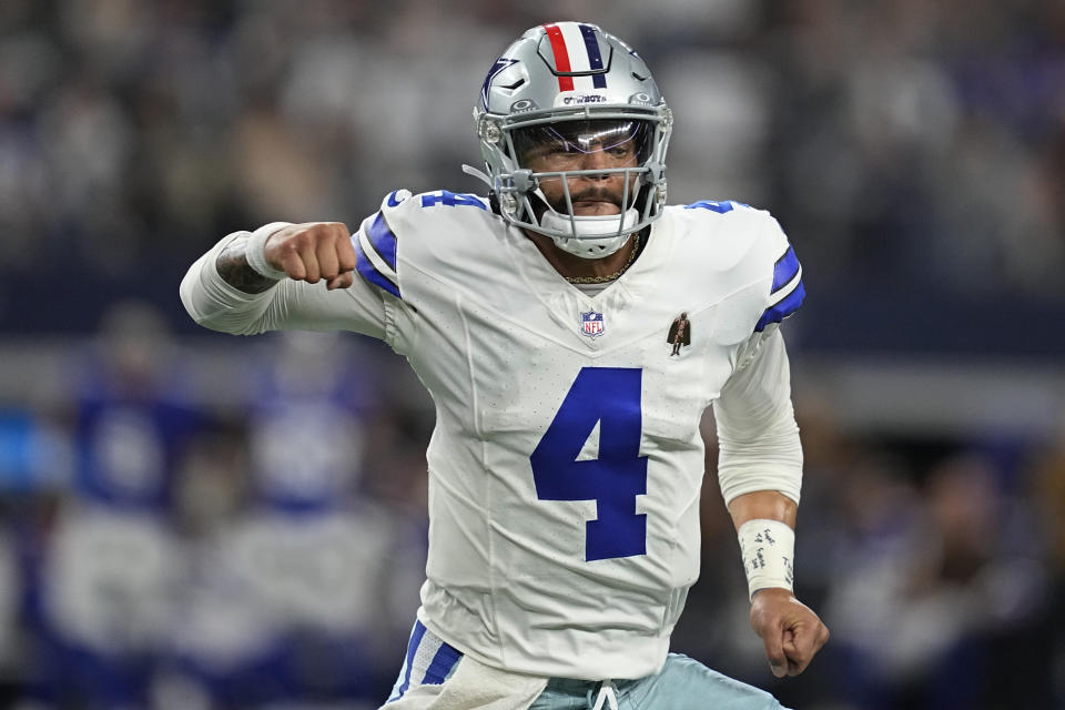 Dallas Cowboys quarterback Dak Prescott (4) celebrates his touchdown pass to teammate Jake Ferguson in the first half of an NFL football game against the New York Giants, Sunday, Nov. 12, 2023, in Arlington, Texas. (AP Photo/Tony Gutierrez)