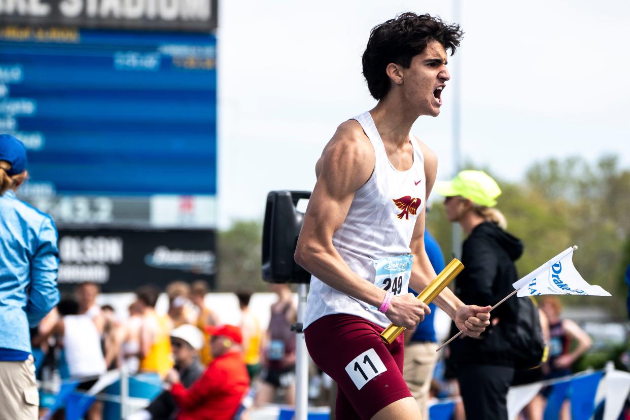 Ankeny's Ethan Zuber celebrates his team's win in the 4x800 meter relay during the Drake Relays at Drake Stadium on Saturday, April 27, 2024, in Des Moines.