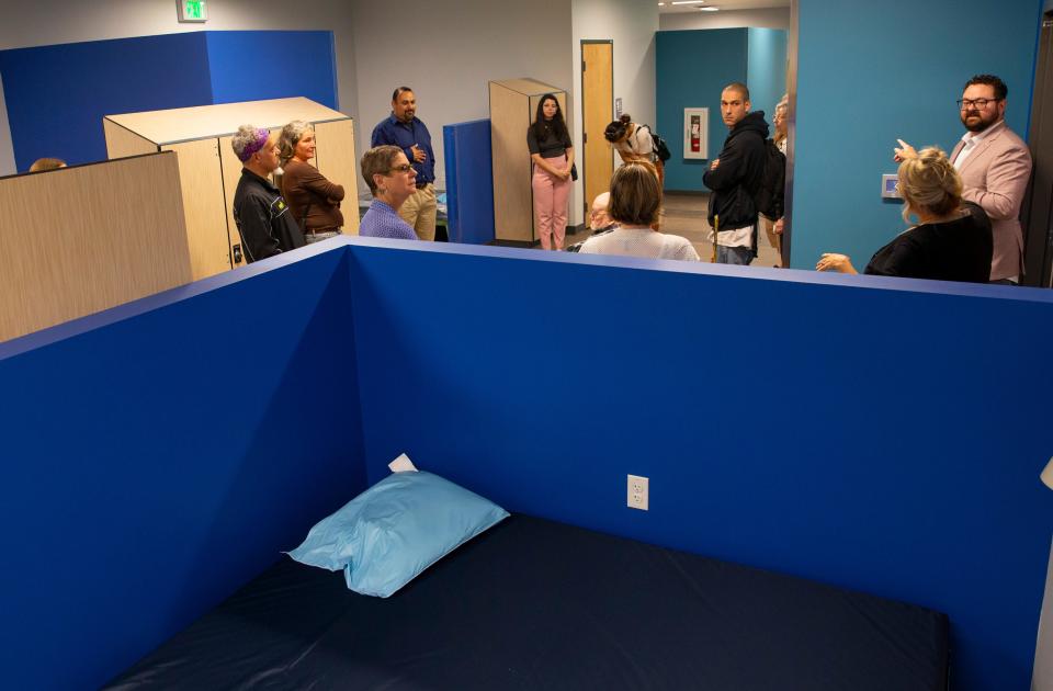 Guests tour one of the sleeping areas at the River Avenue Navigation Center in Eugene during an open house in 2022.