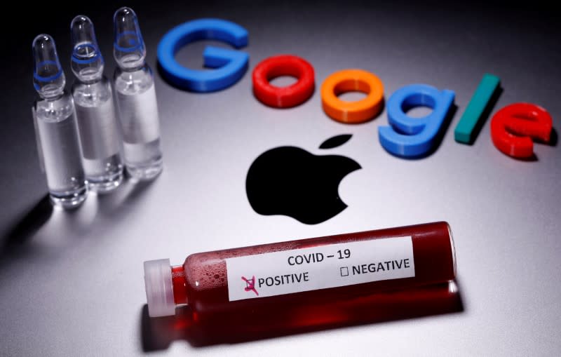 FILE PHOTO: A test tube with fake blood and COVID-19 label and a 3D printed Google logo