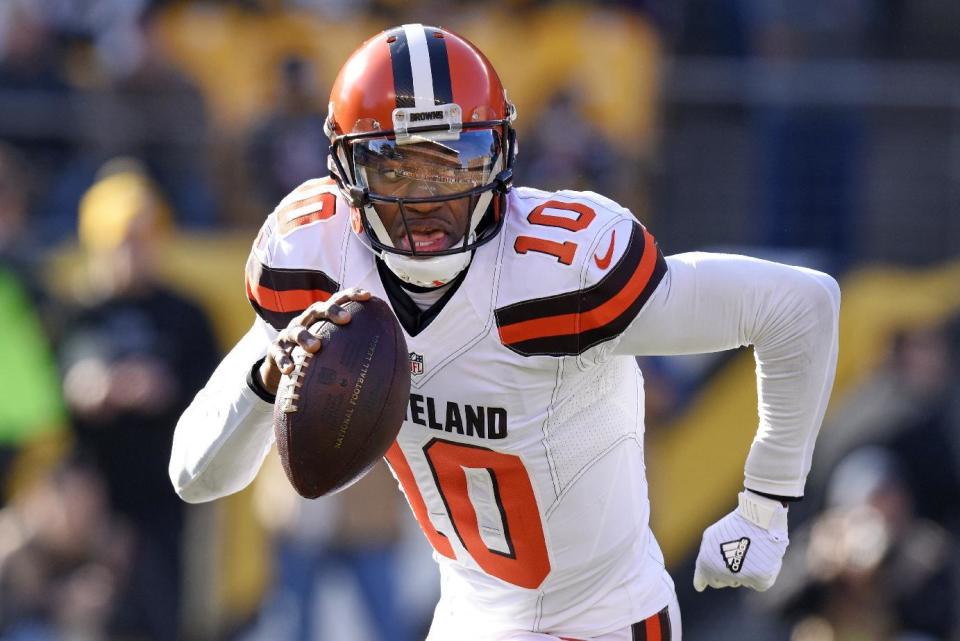 FILE - In this Jan. 1, 2017, file photo, Cleveland Browns quarterback Robert Griffin III (10) rolls out as he looks to pass during the first half of an NFL football game against the Pittsburgh Steelers, in Pittsburgh . A person familiar with the decision says the Browns are releasing quarterback Robert Griffin III after one injury-marred season. Griffin is being let go one day before he would have been due a $750,000 roster bonus, said the person who spoke Friday, March 10, 2017, to the Associated Press on condition of anonymity because the team has not announced the move. (AP Photo/Don Wright, File)