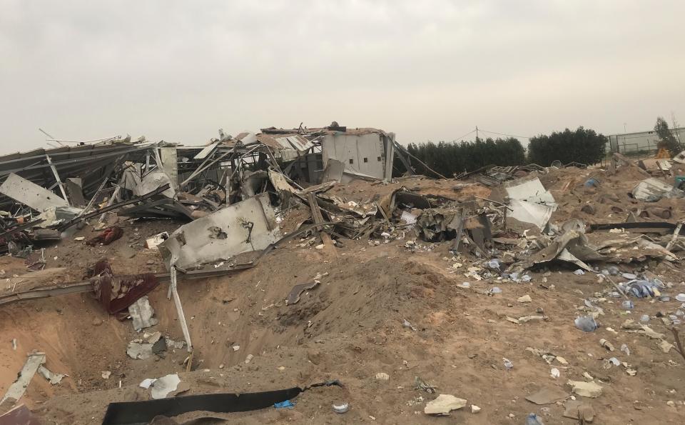 Destroyed buildings are seen at an airport complex under construction in Karbala, Iraq, Friday, March 13, 2020. Iraq's military said five security force members and a civilian were killed early Friday in a barrage of U.S. airstrikes, which were launched hours after a rocket attack killed and wounded American and British servicemen at a base north of Baghdad. (AP Photo/Anmar Khalil)