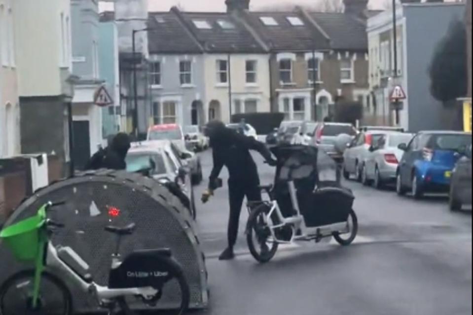 An angle grinder is used to release the bike (Twitter)