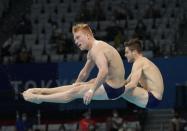 CORRECTS TO HIXON FROM NIXON - Andrew Capobianco and Michael Hixon of the United States' compete during the men's Synchronized 3m Springboard Final at the Tokyo Aquatics Centre at the 2020 Summer Olympics, Wednesday, July 28, 2021, in Tokyo, Japan. (AP Photo/Dmitri Lovetsky)