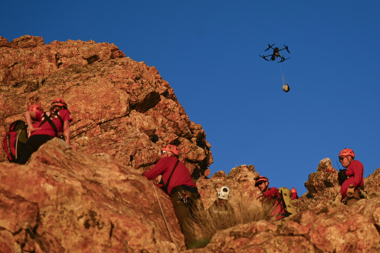 A DJI drone flies supplies to a Weber County Search and Rescue training exercise in Ogden, Utah, on April 11, 2024. (Alex Goodlett/The New York Times)