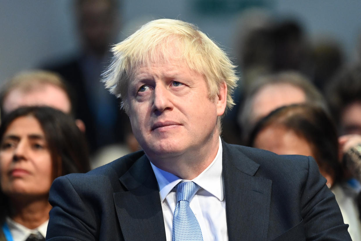 Prime Minister Boris Johnson in the audience as Chancellor of the Exchequer Rishi Sunak addresses the Conservative Party Conference in Manchester. Picture date: Monday October 4, 2021. Photo credit should read: Matt Crossick/Empics