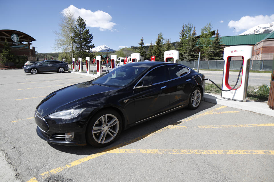 In this Saturday, June 8, 2019, photograph, a Model S sedan charges at a Tesla supercharging station in Silverthorne, Colo. (AP Photo/David Zalubowski)