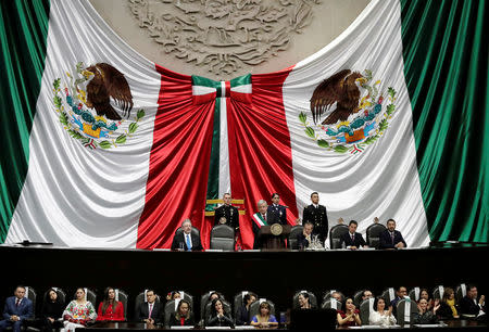 Mexico's new President Andres Manuel Lopez Obrador (with presidential sash) delivers a speech during his swearing in ceremony at Congress, in Mexico City, Mexico December 1, 2018. REUTERS/Henry Romero