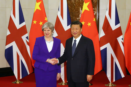 Chinese President Xi Jinping shakes hands with British Prime Minister Theresa May ahead of a meeting at the Diaoyutai State Guesthouse in Beijing, China, February 1, 2018. REUTERS/Wu Hong/Pool