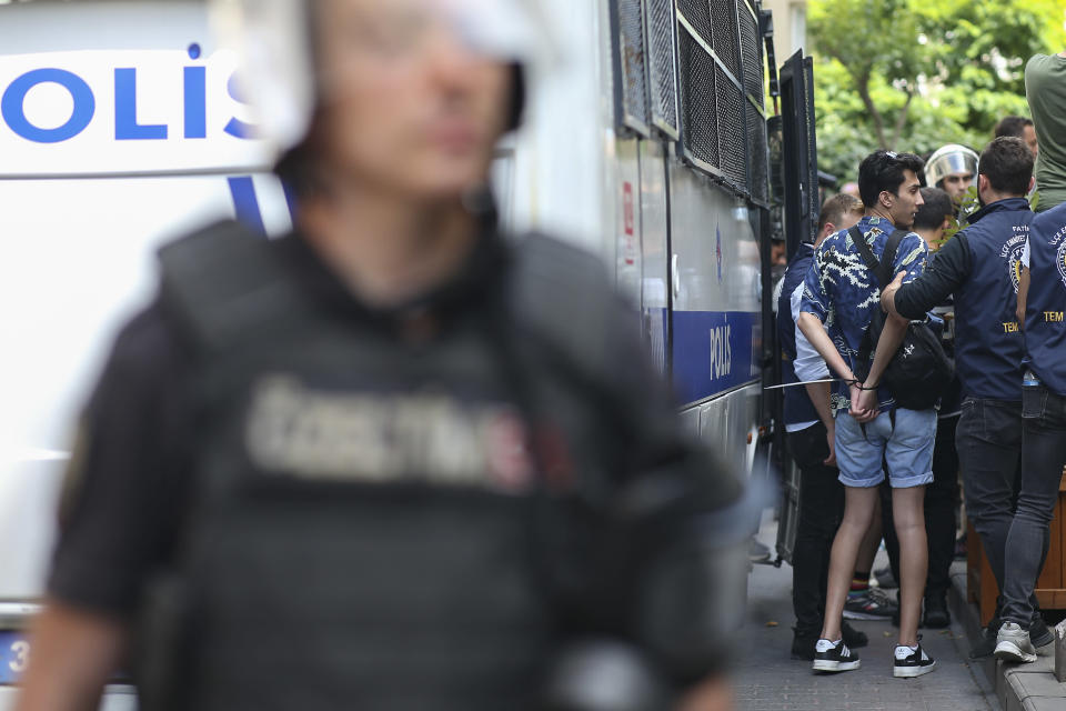FILE - A man is detained during the LGBTQ Pride March in Istanbul, Turkey, Sunday, June 26, 2022. Dozens of people were detained in central Istanbul Sunday after city authorities banned a LGBTQ Pride March, organisers said. (AP Photo/Emrah Gurel, File)