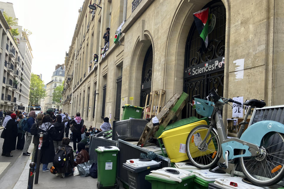 Students block the Sciences-Po university Friday, April 26, 2024 in Paris. Students at a prestigious university resumed pro-Palestinian protests on Friday, days after French police broke up a demonstration, inspired by Gaza solidarity encampments at campuses around the United States. Dozens of students the Sciences-Po university blocked an entrance to a campus building in central Paris with chairs and bikes. (AP Photo/Jeffrey Schaeffer)