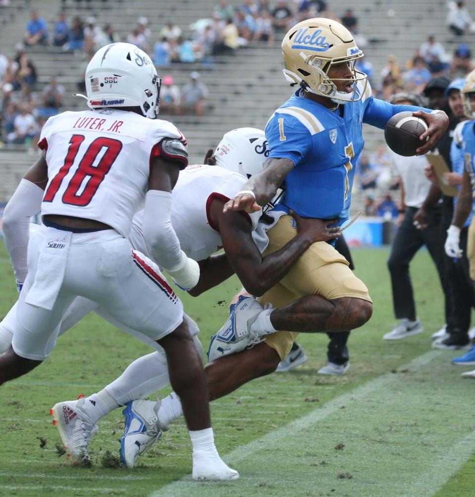 UCLA quarterback Dorian Thompson-Robinson scrambles for two yards against South Alabama