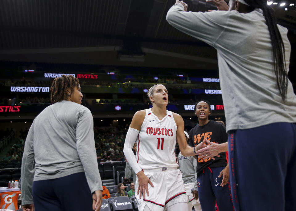 Washington Mystics forward Elena Delle Donne (11) is introduced before Game 1 of the team's WNBA basketball first-round playoff series against the Seattle Storm on Thursday, Aug. 18, 2022, in Seattle. (AP Photo/Lindsey Wasson)