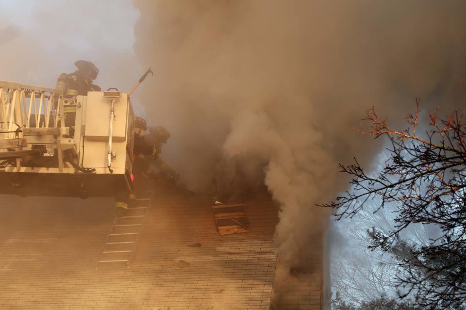 Bridgewater firefighters battle a house fire at 596 Main St. on Friday, Feb. 24, 2023.