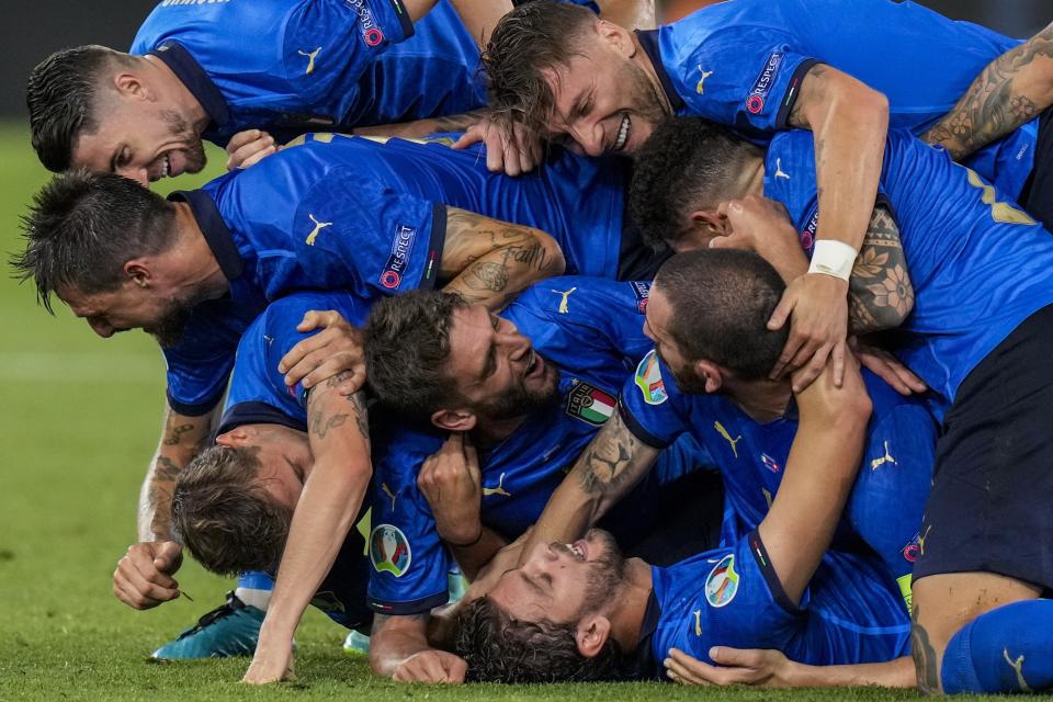 Italian players celebrate their second goal during the Euro 2020 soccer championship group A match between Italy and Switzerland at the Olympic stadium in Rome, Italy, Wednesday, June 16, 2021. (AP Photo/Alessandra Tarantino, Pool)