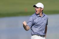 Rory McIlroy of Northern Ireland celebrates after he won the the Dubai Desert Classic, in Dubai, United Arab Emirates, Monday, Jan. 30, 2023. (AP Photo/Kamran Jebreili)