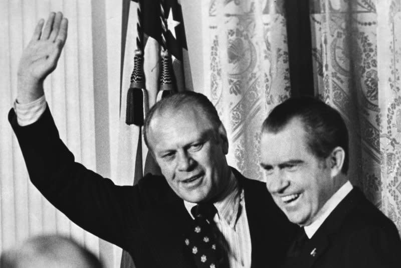 House Republican leader Gerald Ford (R) acknowledges applause after President Richard Nixon tapped him to be vice president of the United Stated on October 12, 1973. On September 8, 1974, then-President Ford granted former President Nixon, who had resigned a month earlier in the wake of the Watergate scandal, a full pardon for any offenses he may have committed during his years in office. UPI File Photo