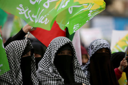 Pro-Palestinian demonstrators wave flags during a protest against the U.S. decision to recognise Jerusalem as the capital of Israel, in Diyarbakir, Turkey, December 17, 2017. REUTERS/Sertac Kayar