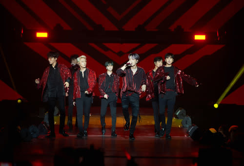 iKON strutting down from the main stage to the extended stage.