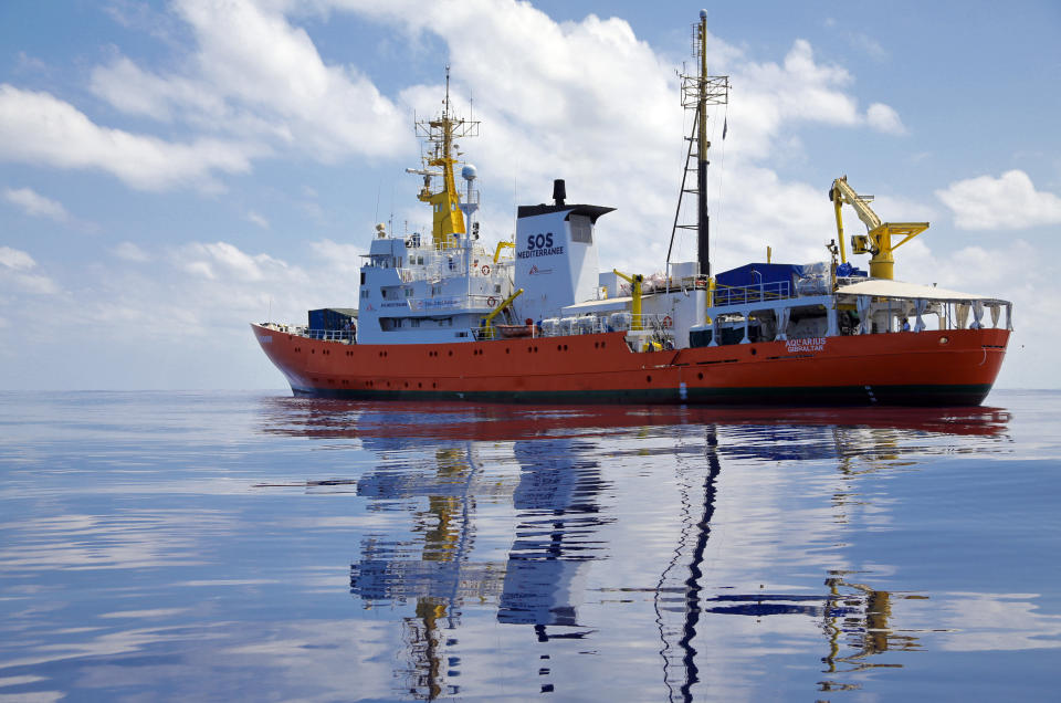 FILE - In this Wednesday, Aug. 23, 2017 file photo, Aquarius the vessel of NGOs, SOS Mediterranee and MSF drifts in the international waters north of Libya. Migrants trying to reach Europe face routine rape and sexual torture throughout their journey _ and especially in Libya _ with men facing abuse nearly as routinely as women, according to a study based on dozens of interviews with aid workers and migrants. (AP Photo/Darko Bandic, File)