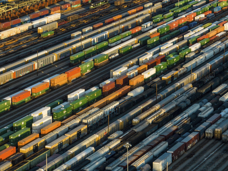 FILE - Freight train cars sit in a Norfolk Southern rail yard on Wednesday, Sept. 14, 2022, in Atlanta. A fifth rail union has approved its deal with the freight railroads to secure 24% raises and $5,000 in bonuses and a sixth one is set to vote Thursday. But all 12 rail unions must ratify their contracts to prevent a strike. (AP Photo/Danny Karnik, File)