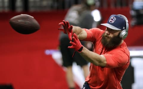 New England Patriots' Julian Edelman warms before the NFL Super Bowl 53 football game between the Los Angeles Rams and the Patriots Sunday, Feb. 3, 2019, in Atlanta. - Credit: AP