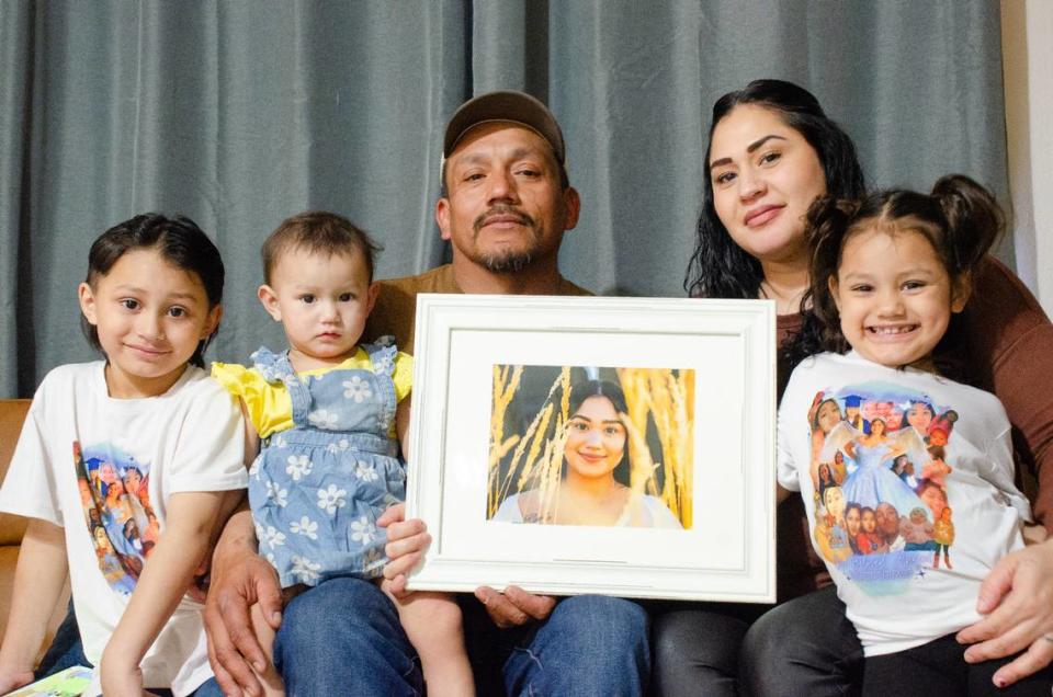 Gabriel Moreno and Angelica Reyes of Kennewick hold a photo of their daughter, Maria, 17, who died in a car crash in November 2023 and would have graduated from Richland High in June. Their other kids are, from left, Gabey Jr., 6, Cheyanne, 1, and Cherylnn, 4.