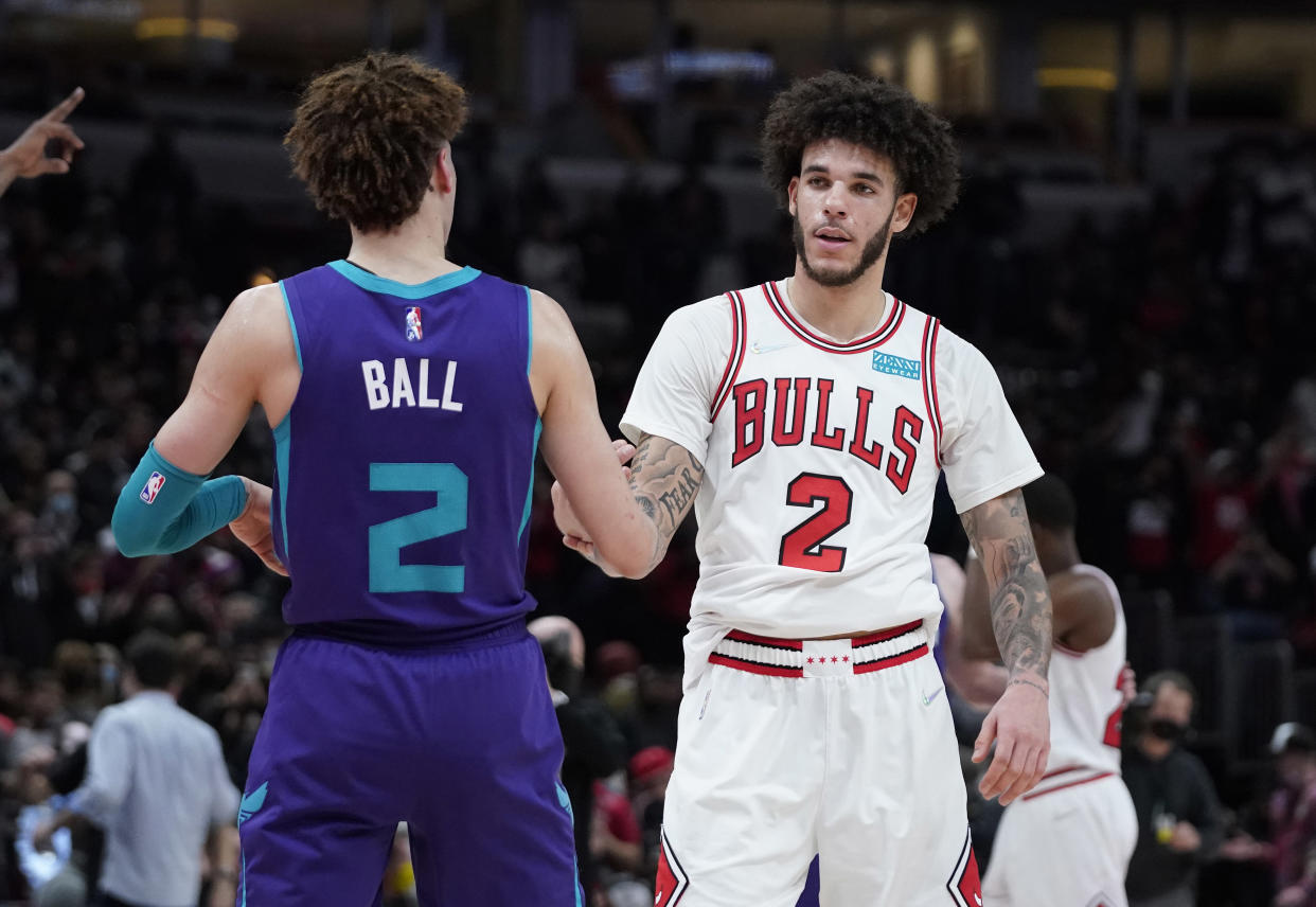 Nov 29, 2021; Chicago, Illinois, USA; Charlotte Hornets guard LaMelo Ball (2) and Chicago Bulls guard Lonzo Ball (2) hug after the game at United Center. Mandatory Credit: David Banks-USA TODAY Sports
