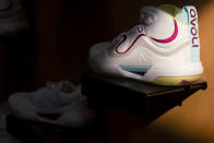 Shoes are displayed at Avoli's headquarters in Portland, Ore., Tuesday, Sept. 19, 2023. Avoli, a volleyball shoe startup is bringing attention to colleges' multi-million-dollar contracts with athletic apparel companies and terms that prevent athletes from wearing other brands. (AP Photo/Jenny Kane)