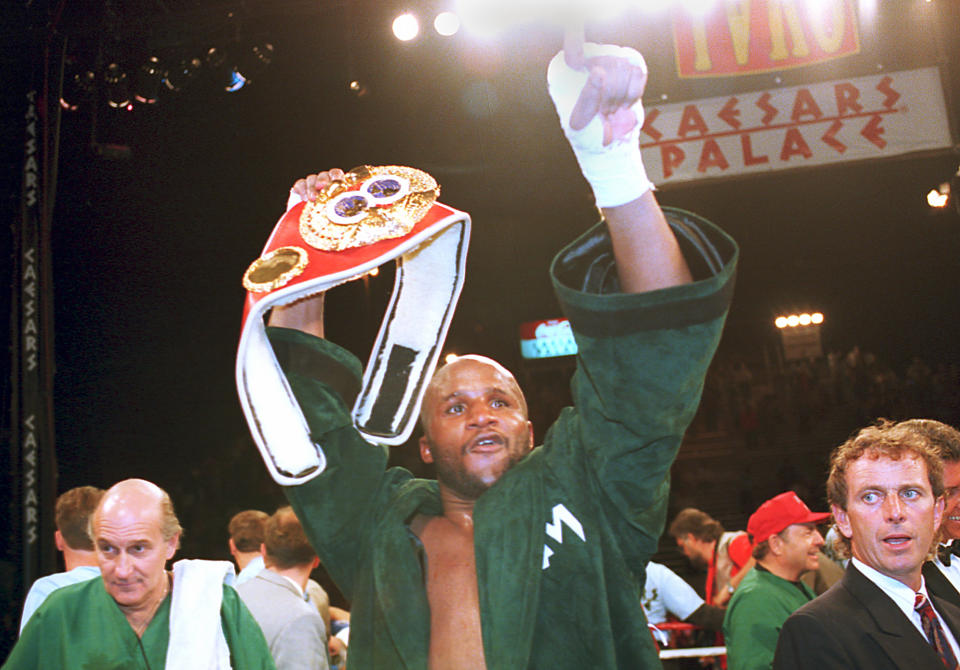 Michael Moorer, new world heavyweight champion, celebrates his win over Evander Holyfield at Caesars Palace in Las Vegas, Nev., Friday, April 22, 1994. Moore defeated Holyfield in a 12-round 3-2 decision. (AP Photo/Susan Ragan)