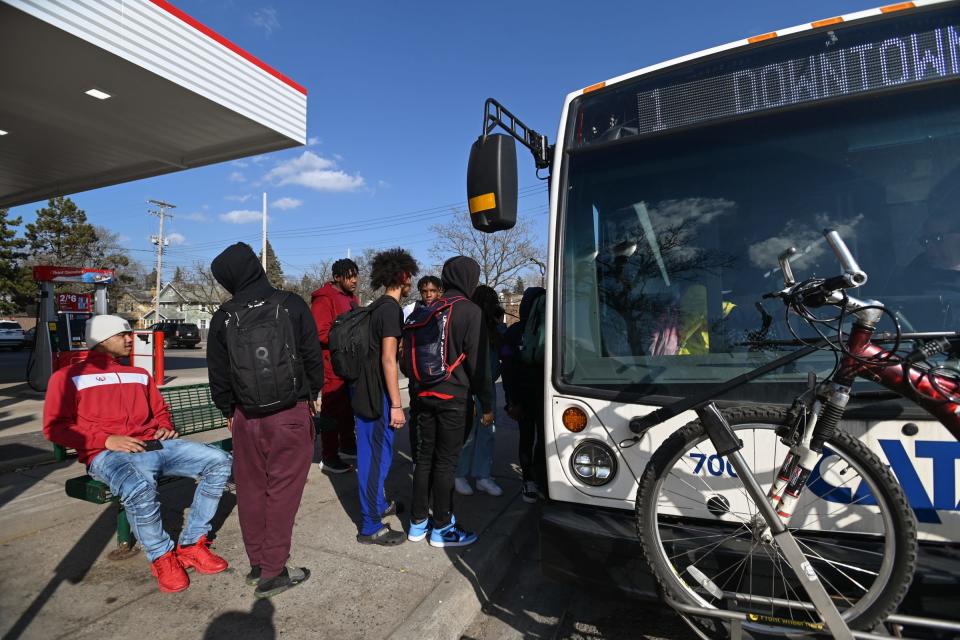 Students from Lansing Eastern High School board the CATA bus after school near East Michigan and North Clemens avenues in Lansing, Tuesday, Feb. 27, 2024.