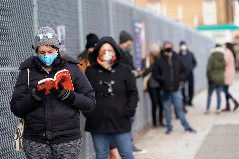 People wait in line outside a New York City Health + Hospitals COVID testing site in the Brooklyn borough of New York, Thursday, Nov. 19, 2020. (AP Photo/Kathy Willens)