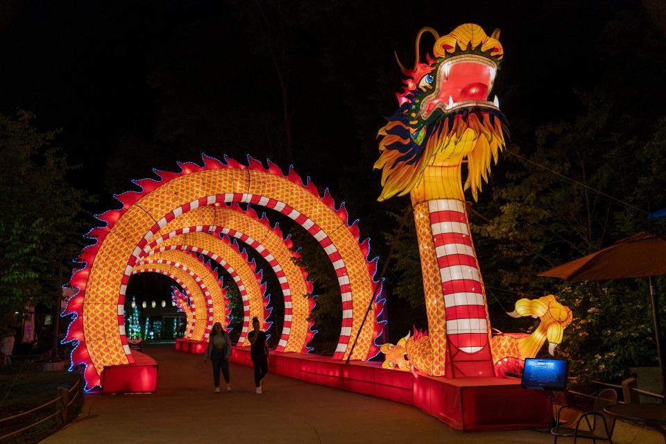 An illuminated dragon tunnel lantern begins the 1-mile loop through the Grand Rapids Lantern Festival at the John Ball Zoo on Wednesday, May 8, 2024.