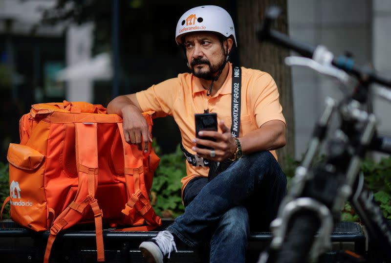 Former Afghan Communication Minister Sadaat works as a bicycle rider for the food delivery service Lieferando in Leipzig